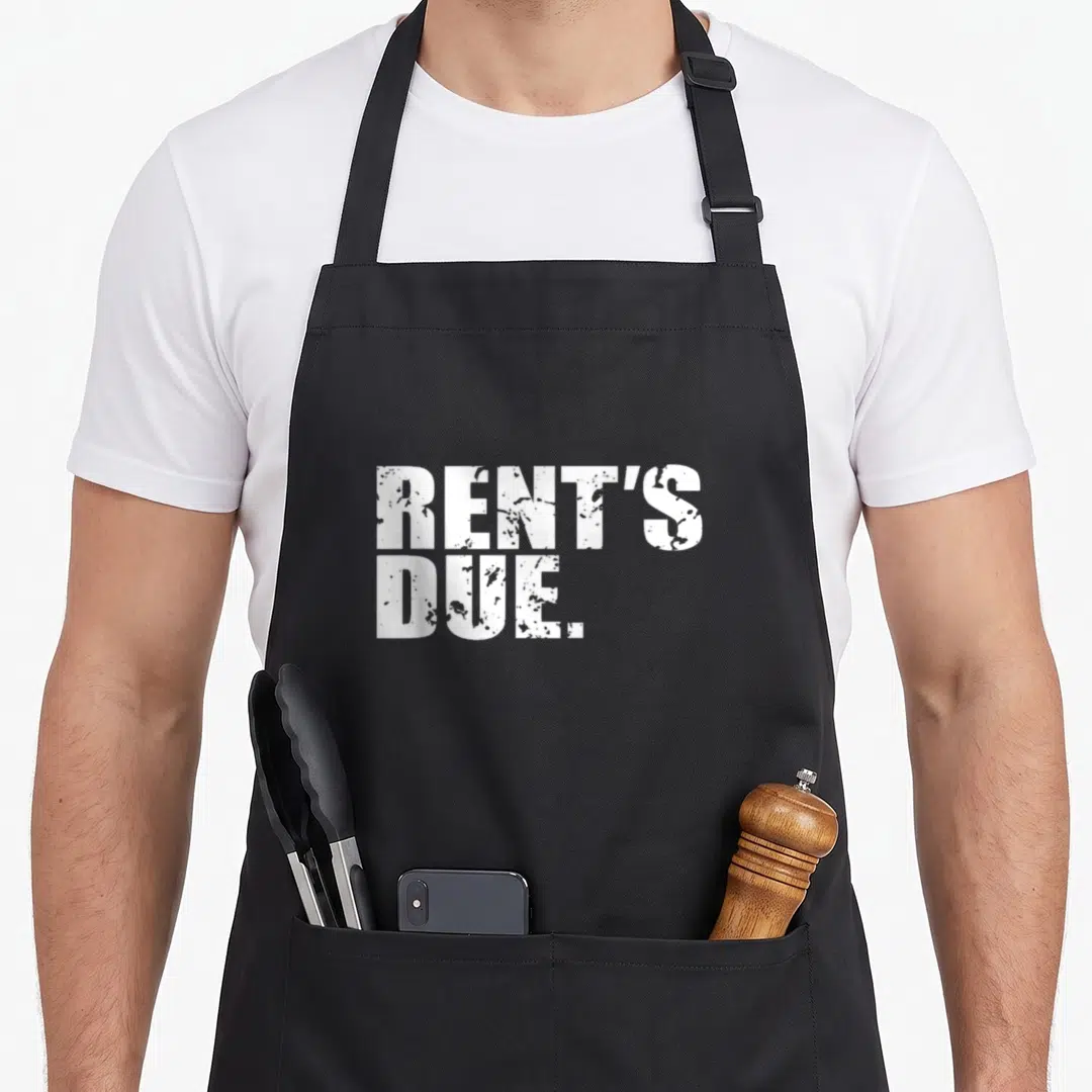 Due distressed apron - White RENT'S DUE. text on black background — shown on a black cotton canvas apron against a white background