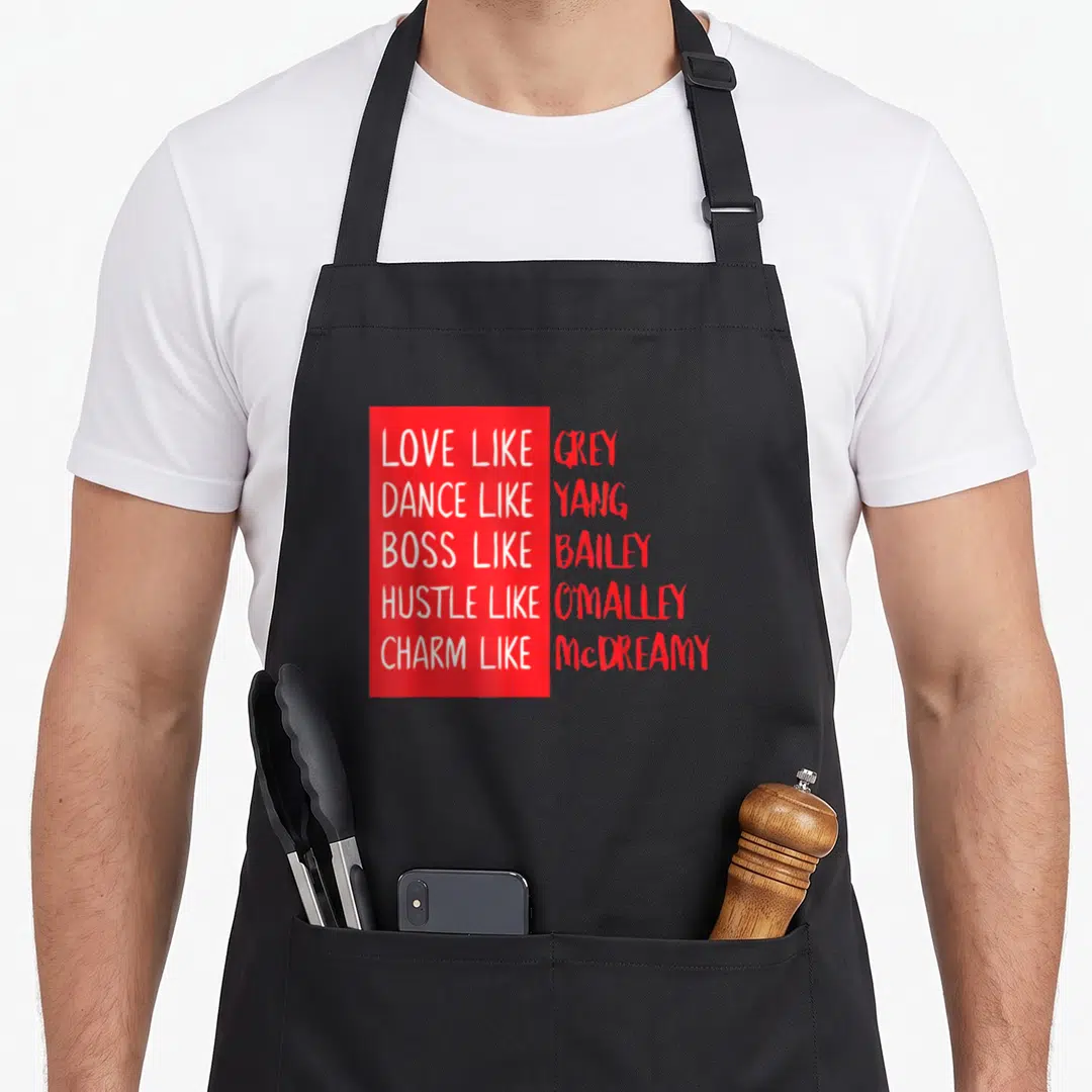 Twisty anatomy apron - Red and white stacked text on grey background quoting TV show characters — shown on a black cotton canvas apron against a white background