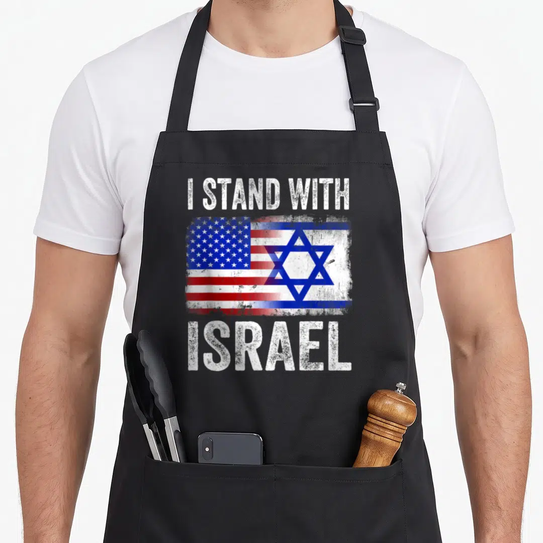 Stand israel patriotic apron - Distressed I STAND WITH ISRAEL text flanking a merged US and Israeli flag graphic in red — shown on a black cotton canvas apron against a white background