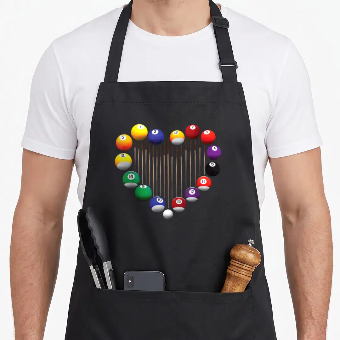 Pool ball billiards apron - Heart shape formed by numbered billiard balls connected by vertical brown lines — shown on a black cotton canvas apron against a white background