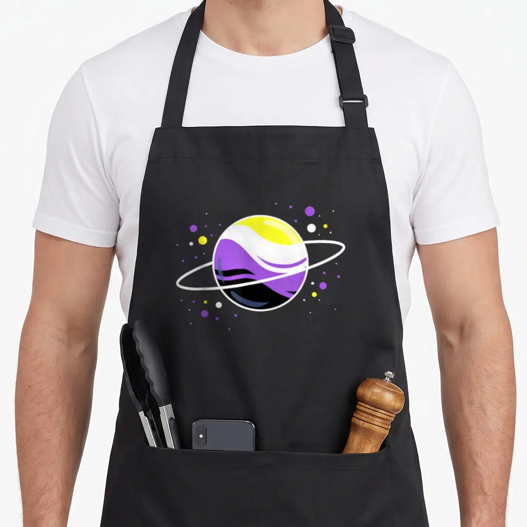 Nonbinary pride apron - Minimalist planet with ring in yellow white purple and black flag colors surrounded by stars — shown on a black cotton canvas apron against a white background