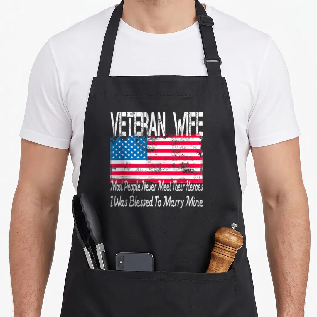 Blessed wife apron - Distressed USA flag with veteran wife text and marriage blessing quote — shown on a black cotton canvas apron against a white background