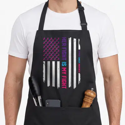 Flag thyroid apron - Distressed flag with pink purple blue ribbons and vertical Her Fight Is My Fight text — shown on a black cotton canvas apron against a white background