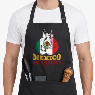 Glove mexico apron - Boxing glove with Mexican flag colors and MEXICO BOXING text above five stars — shown on a black cotton canvas apron against a white background