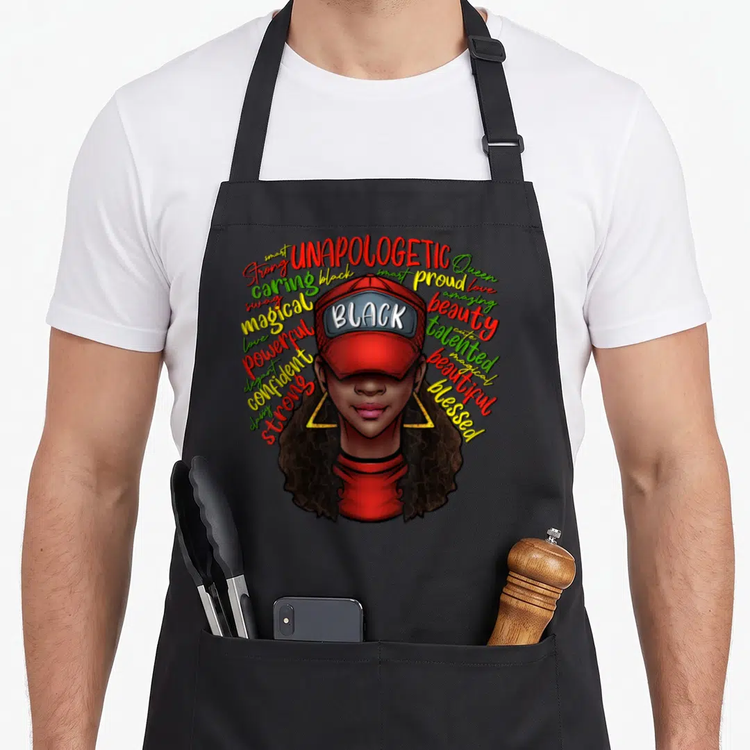 Queen history african american aprons - Cartoon woman in red cap with BLACK text surrounded by colorful affirming — shown on a black cotton canvas apron against a white background