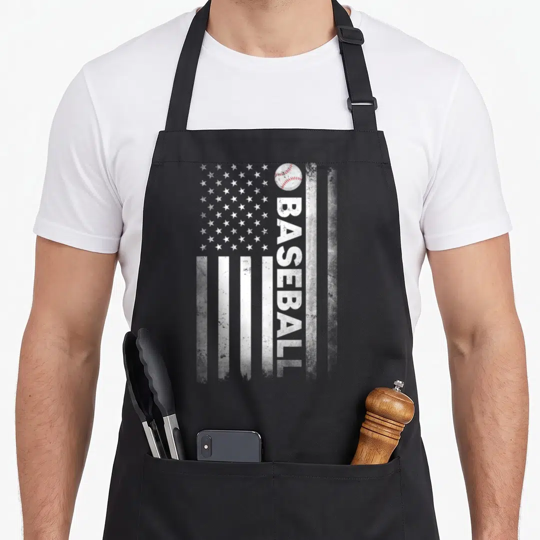 Baseball coach american flag apron - Distressed white USA flag with vertical BASEBALL text and baseball with red — shown on a black cotton canvas apron against a white background