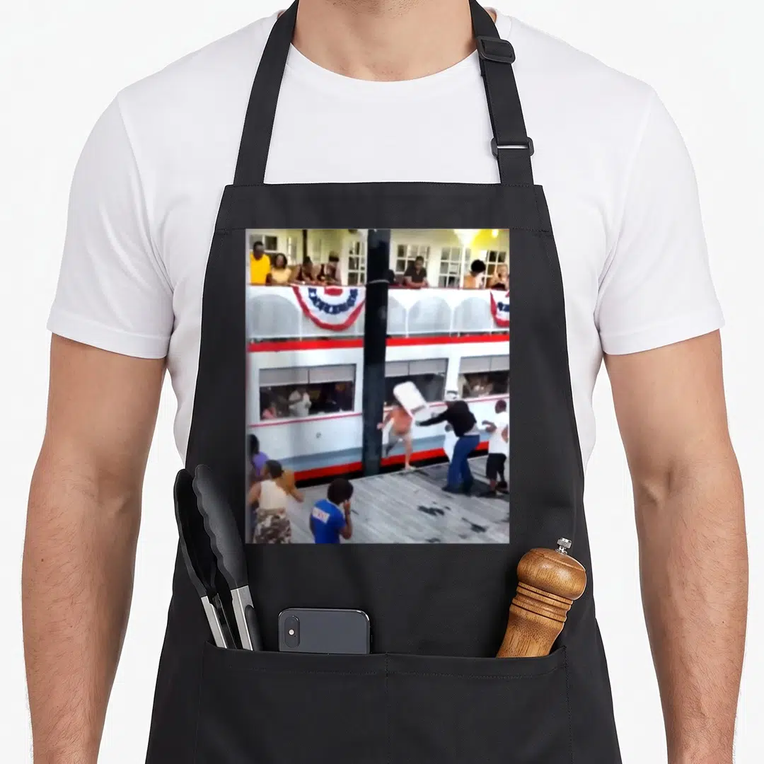 Brawl chair apron - People fighting near white and red double decker boat black pole photo — shown on a black cotton canvas apron against a white background