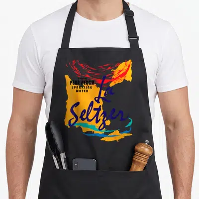 Pear halloween apron - Abstract orange and blue paint splashes with natural pear peach sparkling water text and La — shown on a black cotton canvas apron against a white background