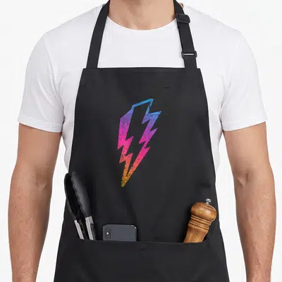 Multicolor distressed apron - Single lightning bolt in blue purple pink orange gradient with distressed texture — shown on a black cotton canvas apron against a white background
