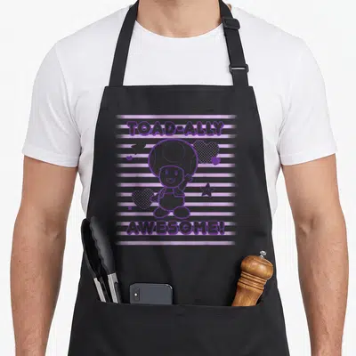 Ally toad apron - Purple Toad character between two text lines over stripes with hearts and stars — shown on a black cotton canvas apron against a white background