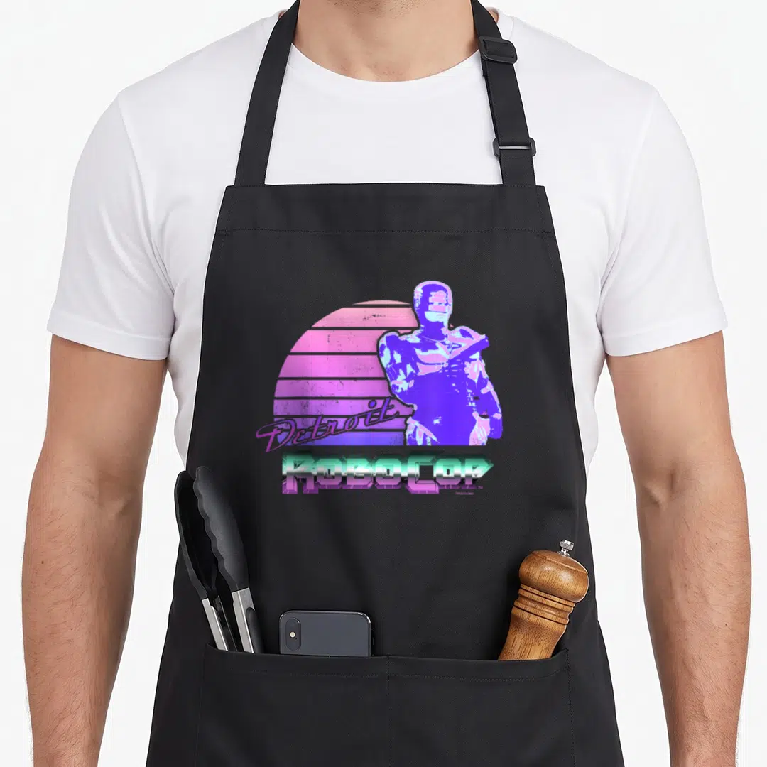 Robocop detroit apron - Purple Robocop figure with pink sun and Detroit script text — shown on a black cotton canvas apron against a white background
