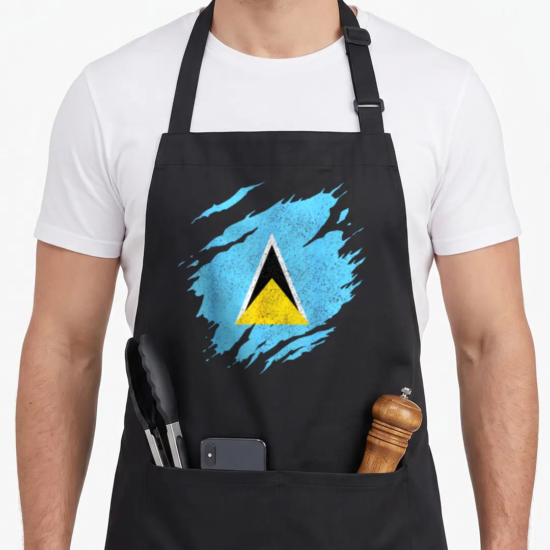 Souvenir saint lucia apron - Distressed flag design in light blue, black, and yellow paint splatter style — shown on a black cotton canvas apron against a white background