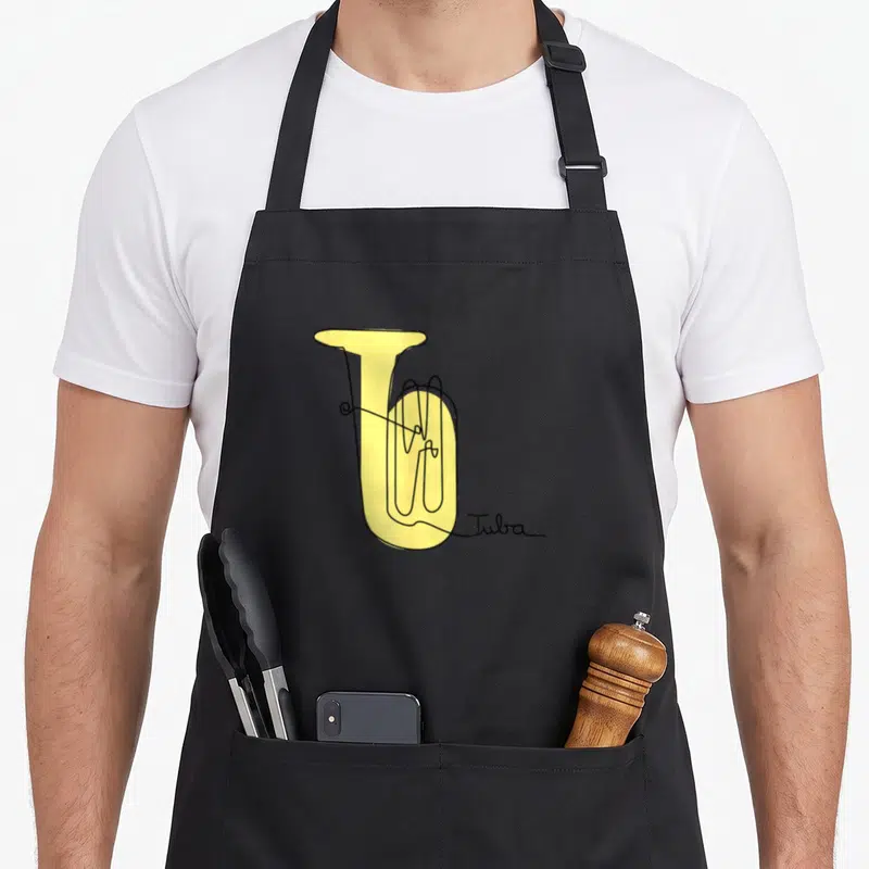 Tubist line apron - Yellow tuba outline drawing with Tuba script signature — shown on a black cotton canvas apron against a white background