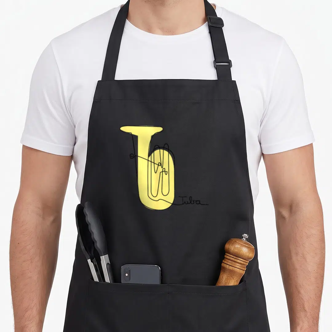 Tubist line apron - Yellow tuba outline drawing with Tuba script signature — shown on a black cotton canvas apron against a white background