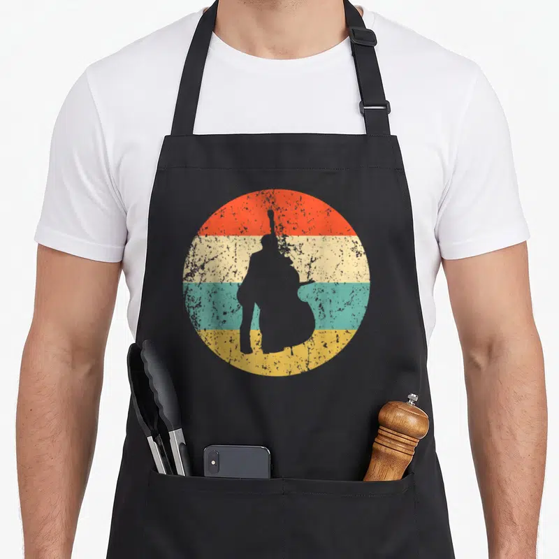 Stand bass apron - Grey double bass player silhouette over four horizontal red cream teal and yellow bands — shown on a black cotton canvas apron against a white background