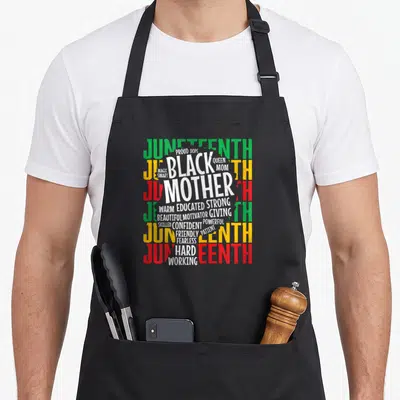 Juneteenth mother's day aprons - Word cloud with BLACK MOTHER in white surrounded by JUNETEENTH in green yellow red — shown on a black cotton canvas apron against a white background