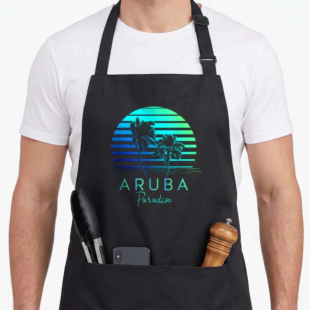 Aruba arugula apron - Retro striped sunset with two palm trees and text ARUBA Paradise in blue and cyan gradients — shown on a black cotton canvas apron against a white background
