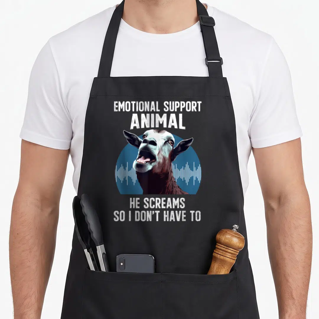 Screaming goat apron - Cartoon goat head screaming over blue soundwave with white text — shown on a black cotton canvas apron against a white background