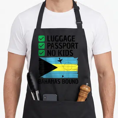 Bahamian travel aprons - Checklist with green boxes and distressed Bahamas flag with airplane silhouette — shown on a black cotton canvas apron against a white background