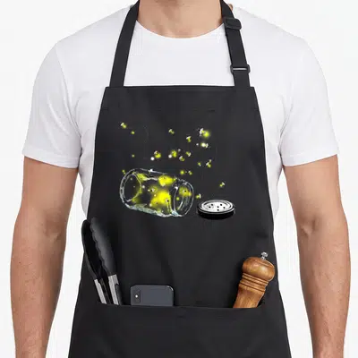 Escaping mason apron - Realistic fireflies with yellow glow and white trails escaping a tipped glass jar and black lid — shown on a black cotton canvas apron against a white background