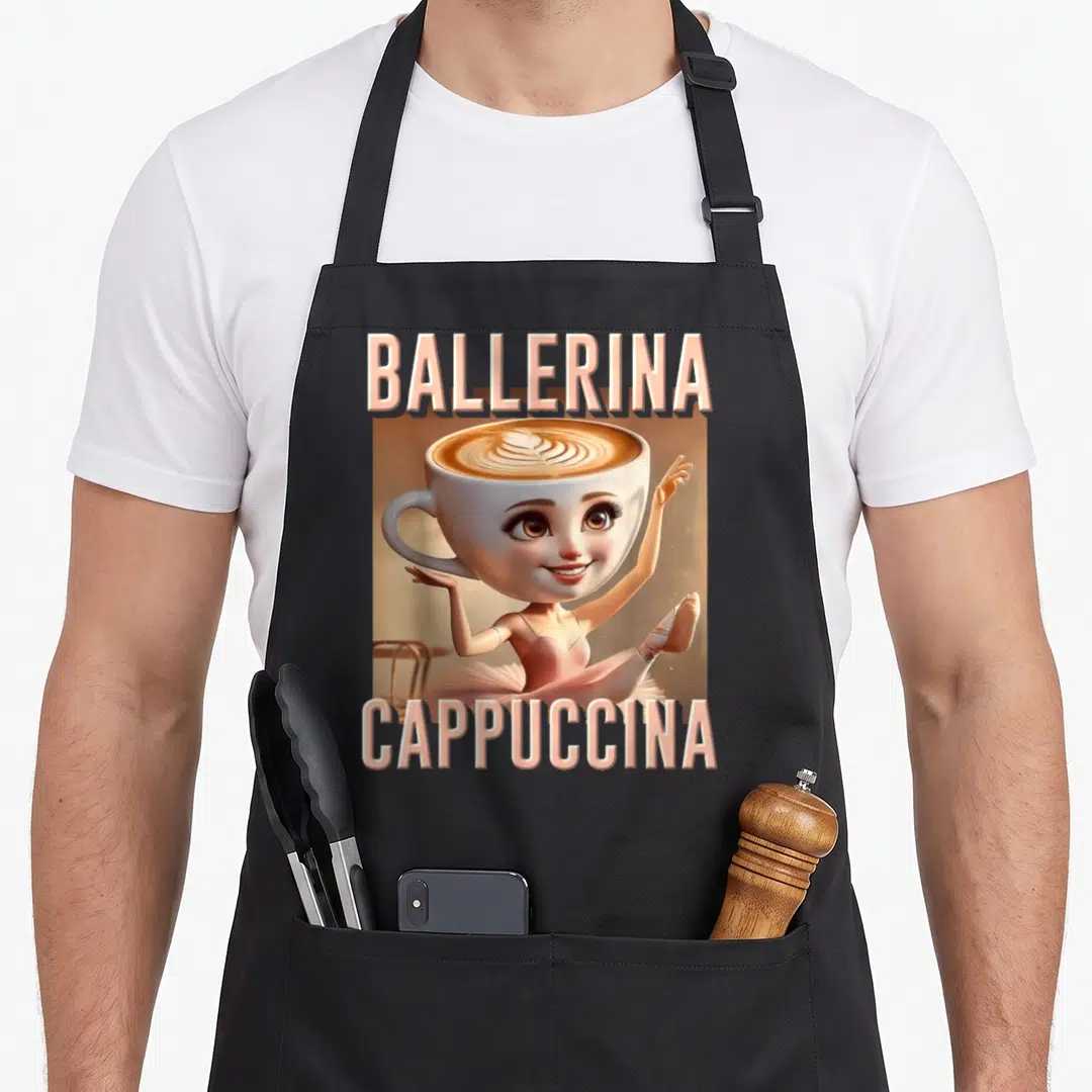 Ballerina italian apron - Cartoon coffee cup ballerina with BALLERINA CAPPUCCINA text in pink and brown — shown on a black cotton canvas apron against a white background