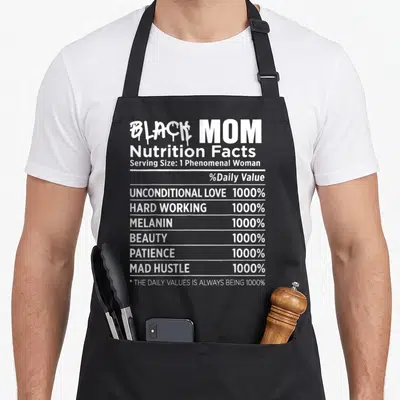 Nutrition mother's day aprons - White typography nutrition label reading Black Mom with 1000% values for love and hustle — shown on a black cotton canvas apron against a white background
