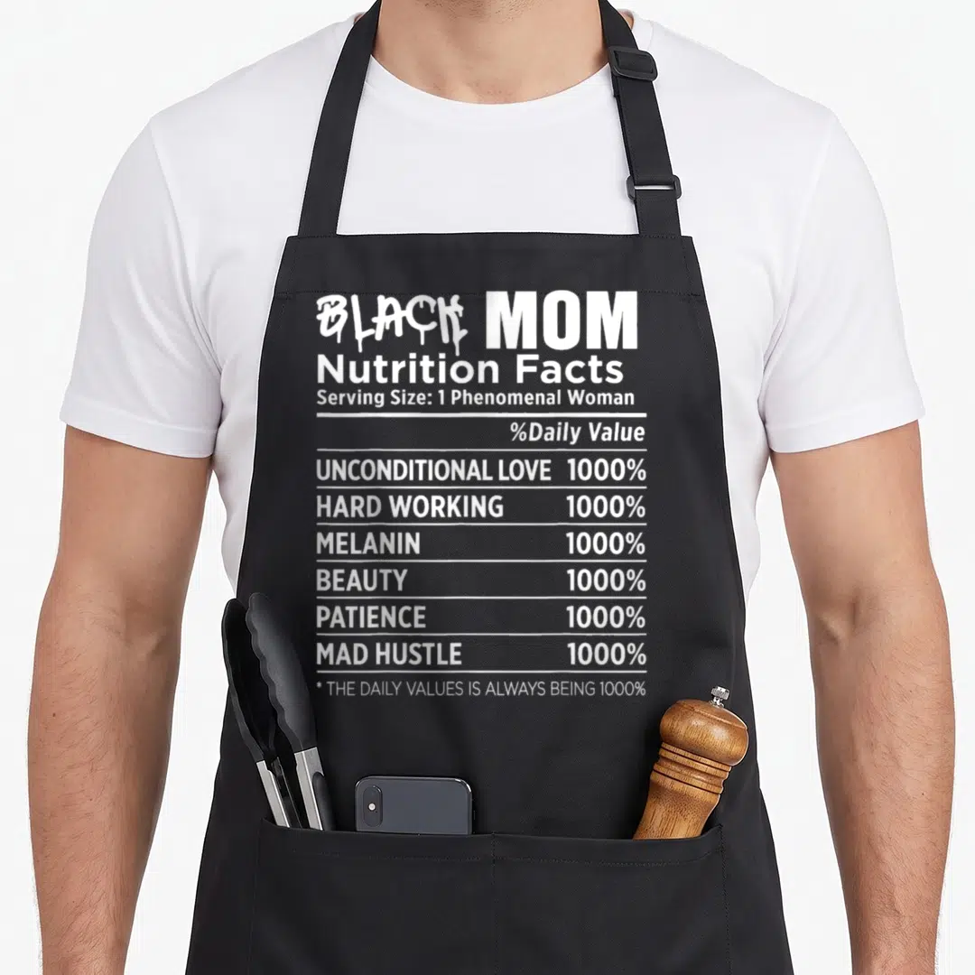 Nutrition mother's day aprons - White typography nutrition label reading Black Mom with 1000% values for love and hustle — shown on a black cotton canvas apron against a white background