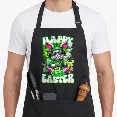 Weed easter bunny aprons - Cartoon rabbit in green hoodie and sunglasses holding joint and egg basket with HAPPY 420 — shown on a black cotton canvas apron against a white background