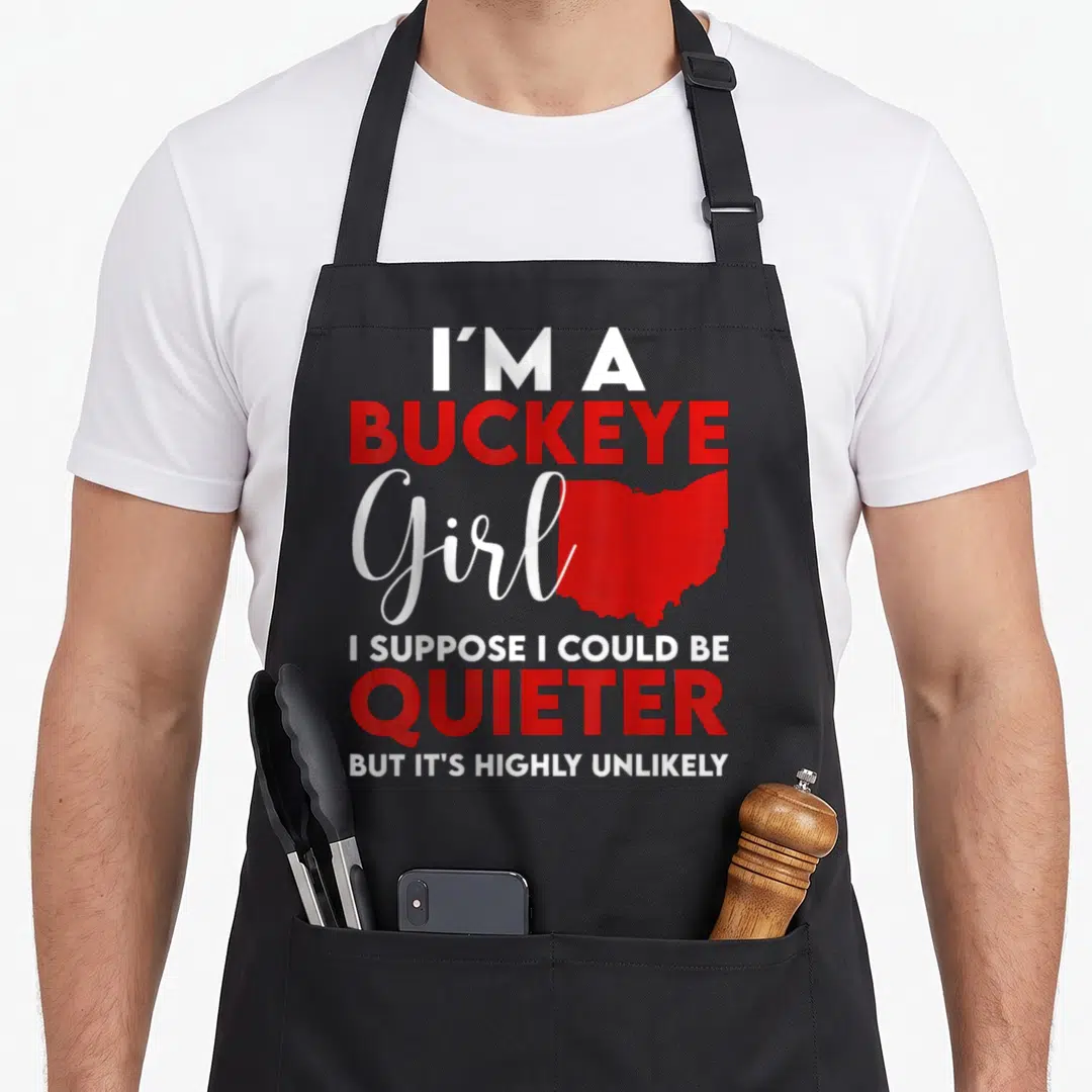 Vintage buckeye apron - Red Ohio state map next to white and red text reading I'm a Buckeye Girl — shown on a black cotton canvas apron against a white background