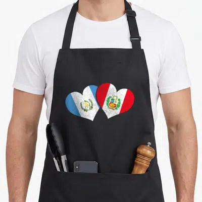 Peru guatemalan aprons - Two overlapping hearts filled with Peruvian and Guatemalan flag stripes and coats of arms — shown on a black cotton canvas apron against a white background