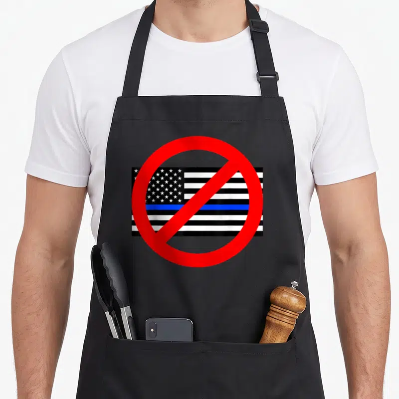 Circle police apron - Red prohibition circle over black white and blue striped flag with stars — shown on a black cotton canvas apron against a white background