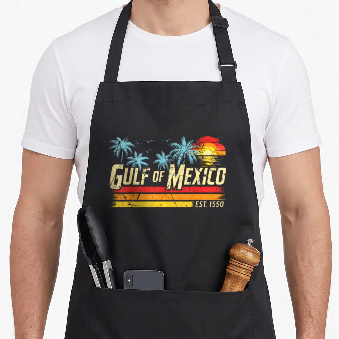Forever mexico apron - Retro Gulf of Mexico text with palm trees, sunset stripes, and EST 1550 on black apron — shown on a black cotton canvas apron against a white background