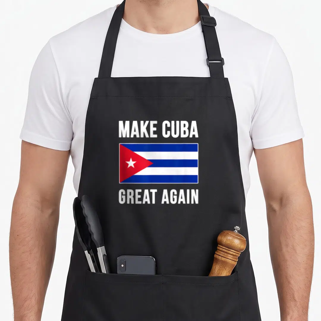 Flag cuba apron - Make Cuba Great Again text above and below blue white and red Cuban flag — shown on a black cotton canvas apron against a white background