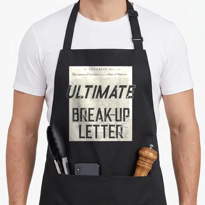 Declaration ultimate apron - Distressed black Ultimate Break-Up Letter text over the 1776 Declaration of Independence — shown on a black cotton canvas apron against a white background