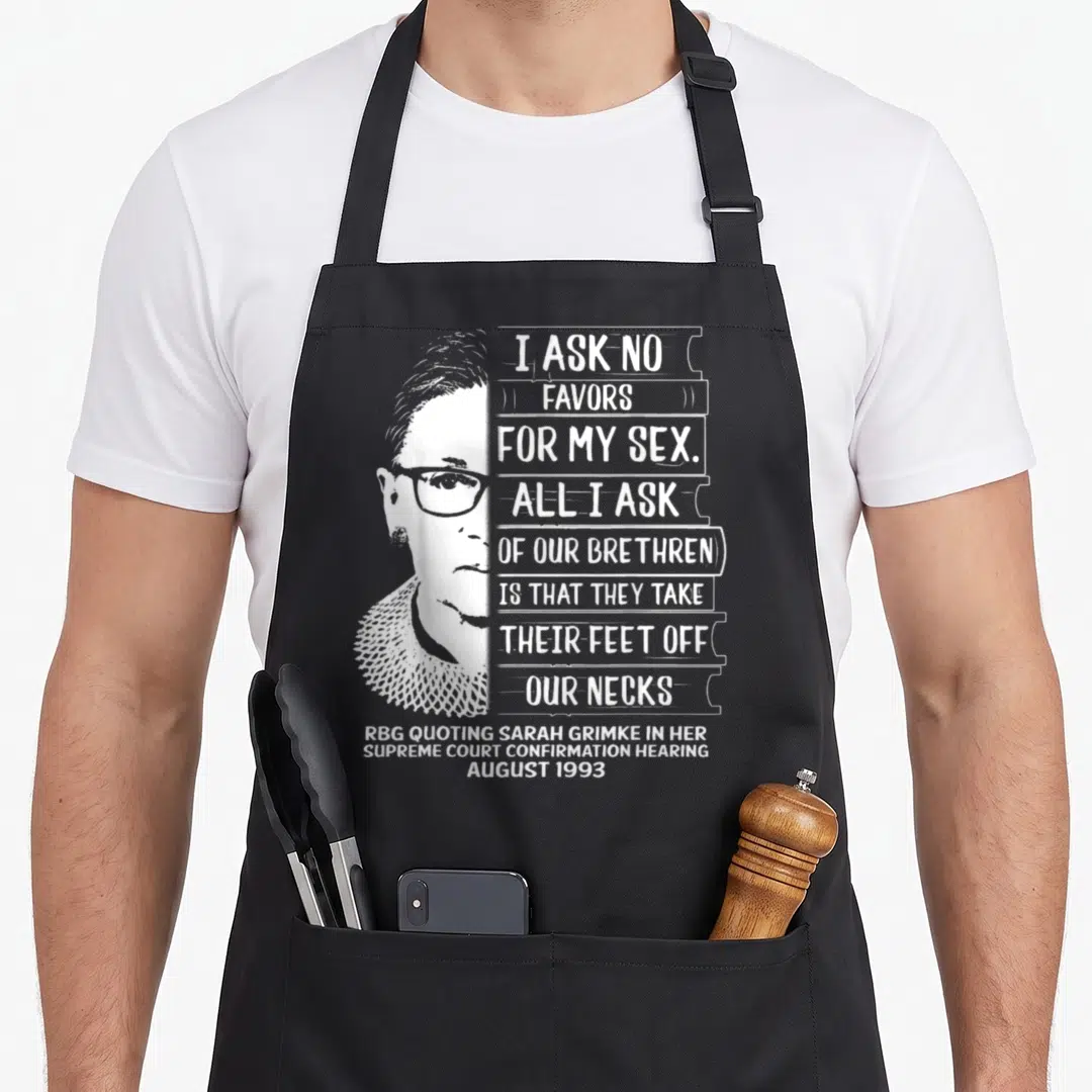 Resistance rally apron - White distressed RBG portrait next to stacked quote bars citing 1993 confirmation hearing — shown on a black cotton canvas apron against a white background