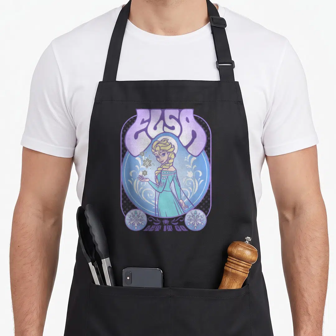 Seventy drink apron - Cartoon Elsa in blue circle with purple ELSA text and two snowflakes — shown on a black cotton canvas apron against a white background