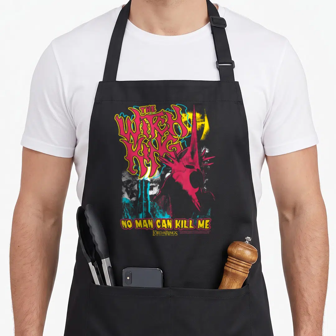 Lotr heavy metal apron - Red Witch-king helmet silhouette beside stacked yellow THE WITCH KING text and NO MAN CAN KILL — shown on a black cotton canvas apron against a white background