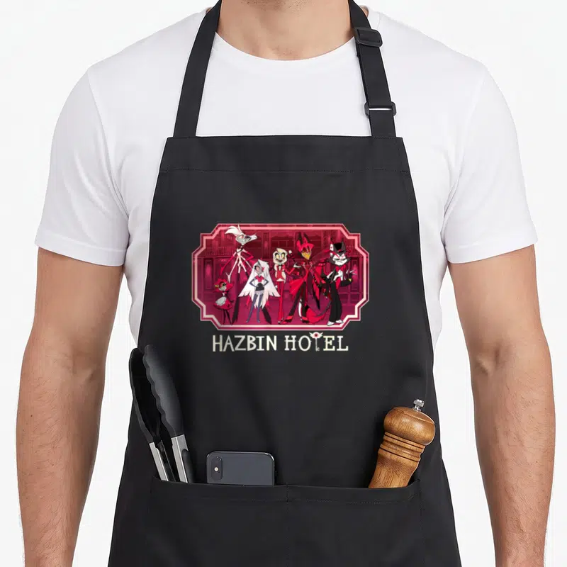 Hazbin hotel aprons - Five cartoon characters in pink frame with HAZBIN HOTEL text below on red background — shown on a black cotton canvas apron against a white background