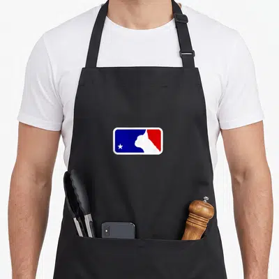 Funny french bulldog apron - White cat silhouette and star on split blue and red background inside white border — shown on a black cotton canvas apron against a white background