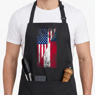 Georgia georgian american flag apron - Merged US and Georgia flags split diagonally with distressed red white and blue — shown on a black cotton canvas apron against a white background