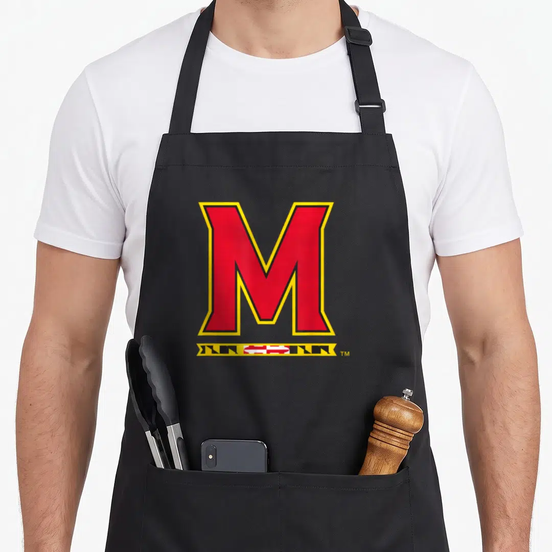 Icon university maryland apron - Red M with yellow outline above black white and red banner — shown on a black cotton canvas apron against a white background