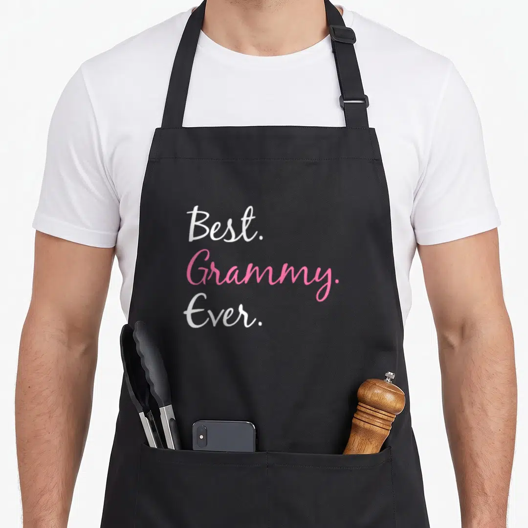 Cute grammy apron - Stacked white and pink cursive text reading Best Grammy Ever — shown on a black cotton canvas apron against a white background