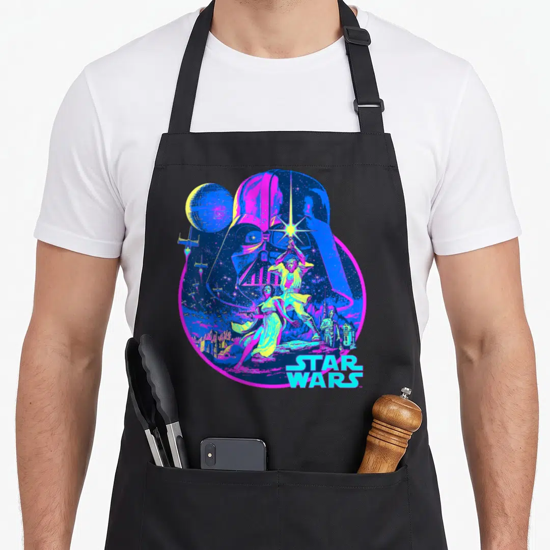Bright war apron - Neon Darth Vader silhouette containing Luke, Leia, C-3PO, R2-D2, Death Star, and X-wings in retro — shown on a black cotton canvas apron against a white background