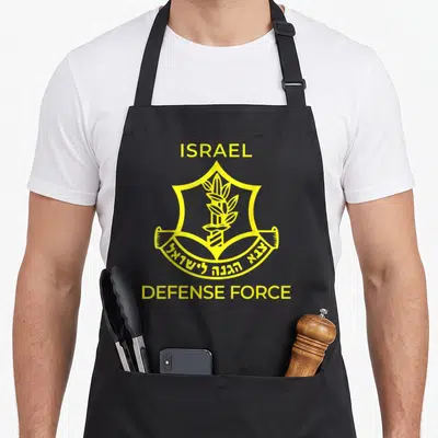 Defense israeli boy apron - Yellow IDF emblem with ISRAEL text, Hebrew banner, and shield design — shown on a black cotton canvas apron against a white background