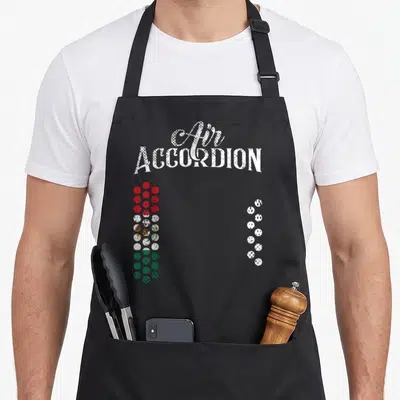 Flag mexican apron - Air ACCORDION text above red white and green button columns mimicking instrument keys — shown on a black cotton canvas apron against a white background