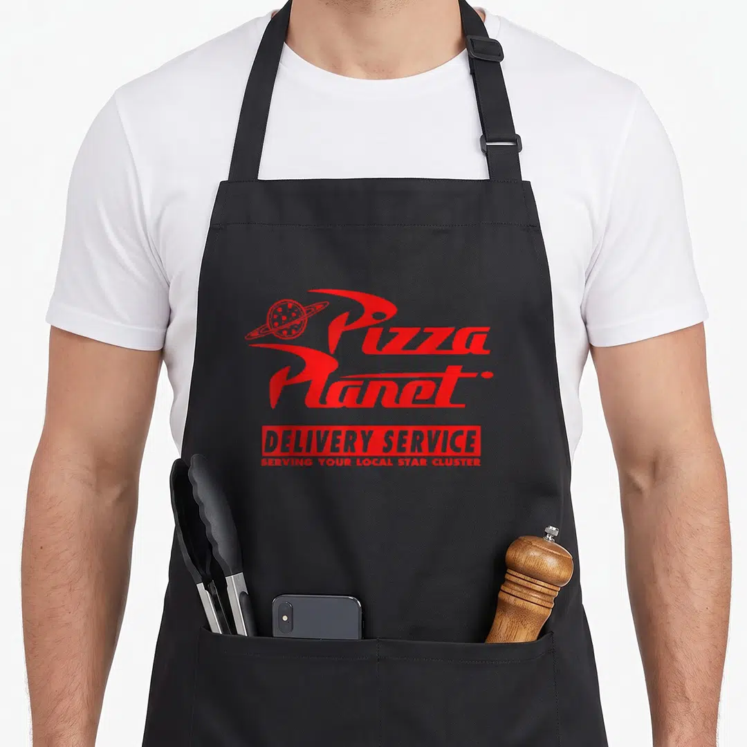 Pizza service apron - Red Pizza Planet logo with ringed planet and Delivery Service text on canvas — shown on a black cotton canvas apron against a white background