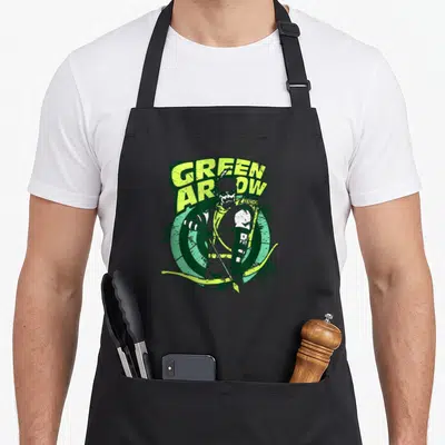 Arrow target apron - Green Arrow character in front of target with distressed text and splattered effects — shown on a black cotton canvas apron against a white background