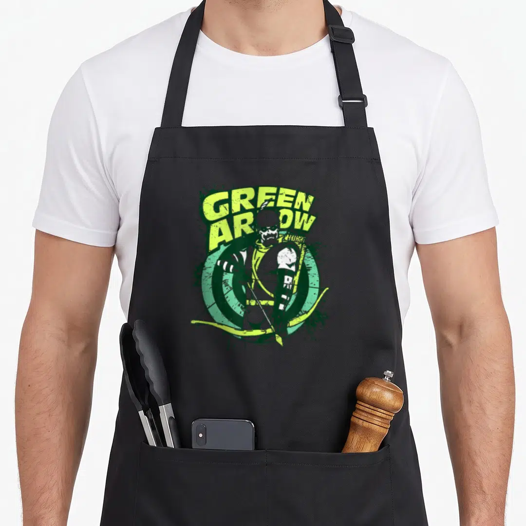 Arrow target apron - Green Arrow character in front of target with distressed text and splattered effects — shown on a black cotton canvas apron against a white background
