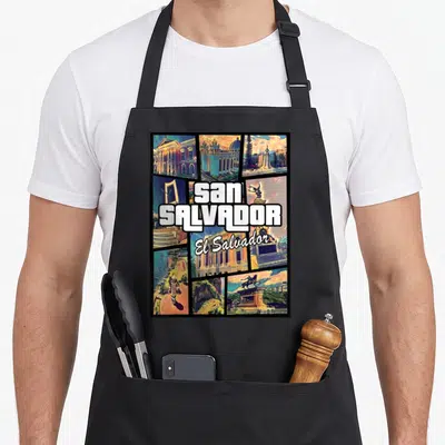 San el cook apron - Retro collage of San Salvador landmarks with stacked white text over colorful city scenes — shown on a black cotton canvas apron against a white background