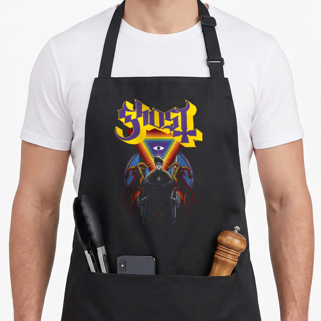 Alchemist ghost apron - GHOST text, rainbow triangle, eye, seated figure, two goats, circular frame — shown on a black cotton canvas apron against a white background